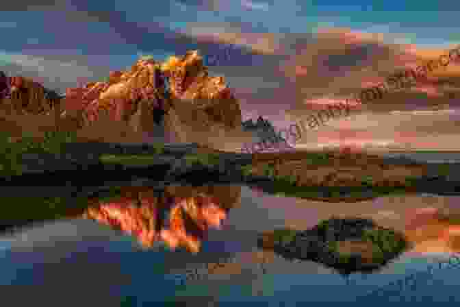 A Breathtaking Landscape Photograph By FX John, Featuring A Golden Sunset Over A Mountain Range FX: John S Photobook John Hartig