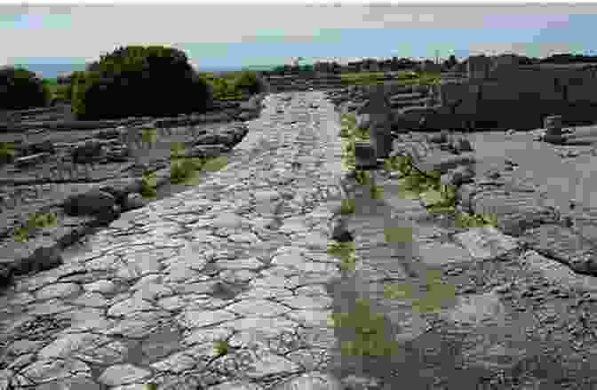 A Photo Showcasing The Well Preserved Remains Of A Roman Road, Demonstrating The Durability And Engineering Prowess Of Ancient Roman Construction Science And Technology In Ancient Rome: The History And Legacy Of The Romans Technological Advances